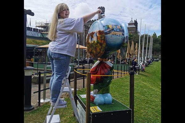 Kayleigh Ashman with her sculpture at Cardiff Castle