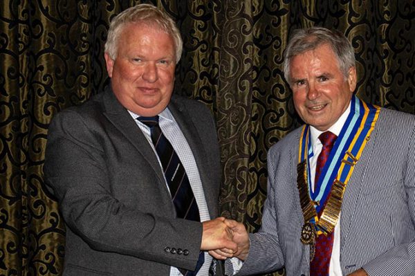 Outgoing president Edward Williams-Price presenting the new president David Curtis with the chain of office