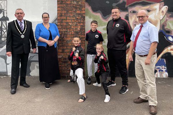 From left: David Davies, Vice Chair of BTM community council, Amanda McConnell, councillor for Machen and Rudry, four athletes who travelled to Poland and Chris Morgan, councillor for Machen and Rudry