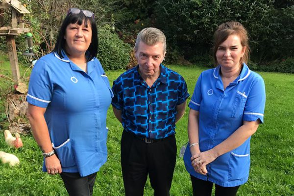 Philip Robinson with carers Sue Loxton, left, and Leanne Gardner, right