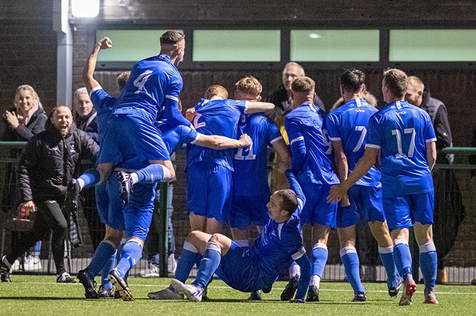 Trethomas Bluebirds players celebrating their shock victory over Haverfordwest County