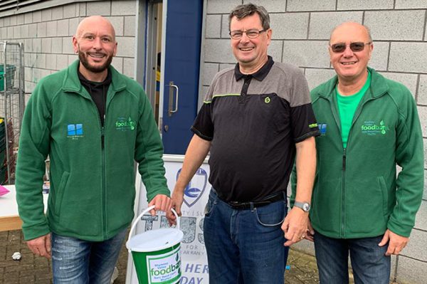 Supporters trust board member Keith Morgan, centre, with Steve Evans-Jones, left, and Stephen Holdroyd of the Rhymney Valley Foodbank