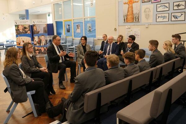Bank of England governor Andrew Bailey speaking with St Cenydd pupils