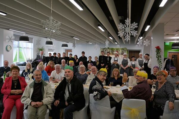Blackwood Stroke Group with student chefs at Coleg y Cymoedd's Scholars restaurant in Ystrad Mynach