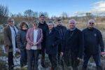 From left: Council cabinet members Elaine Forehead, Philippa Leonard, Carol Andrews, Jamie Pritchard, Nigel George, Shayne Cook, Sean Morgan and Chris Morgan at the proposed site of Caerphilly's new leisure centre