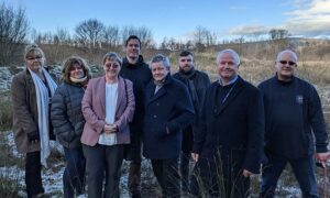 From left: Council cabinet members Elaine Forehead, Philippa Leonard, Carol Andrews, Jamie Pritchard, Nigel George, Shayne Cook, Sean Morgan and Chris Morgan at the proposed site of Caerphilly's new leisure centre