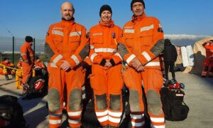 Emma Atcherley, centre, with fellow South Wales firefighters Luke Davison, left, and Robert Buckley