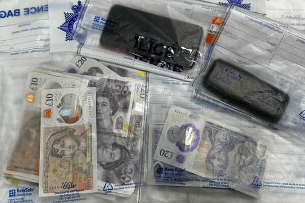 Phones and cash seized by police during a search warrant in Hendredenny
