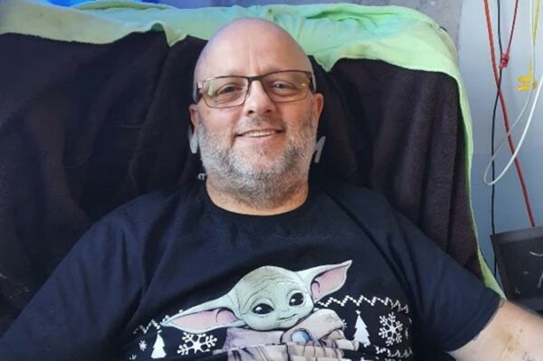 Peter Belson recovering in hospital after suffering a cardiac arrest