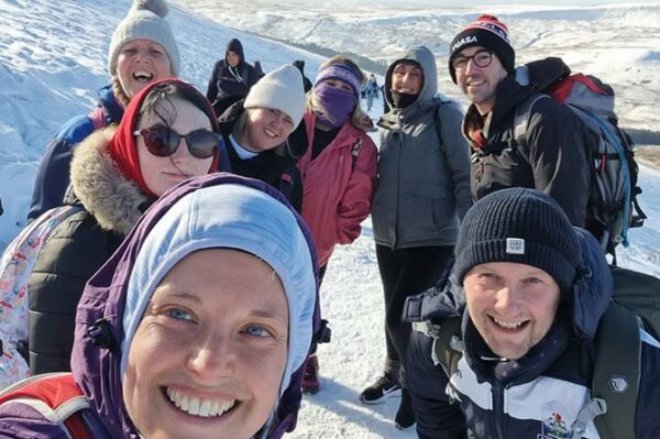 Staff at Ysgol Gymraeg Gilfach Fargod climbed Pen y Fan 20 times between them