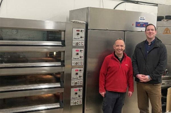 Acorns Bakery owner Patrick Peachey, left, shows Cllr Jamie Pritchard his new ovens and freezer