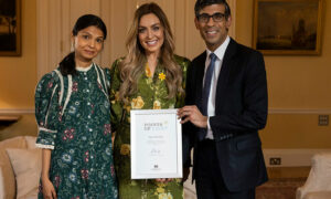Amy Dowden, centre, receives her Points of Light award from Prime Minister Rishi Sunak and his wife Akshata Murthy