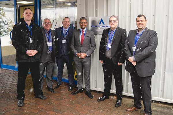 Cllr Jamie Pritchard, left, and Economy Minister Vaughan Gething, fourth from left, were among the guests at Atlantic Service Company's official opening in Blackwood
