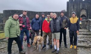 Members of the Men Talk Walk group at Caerphilly Castle