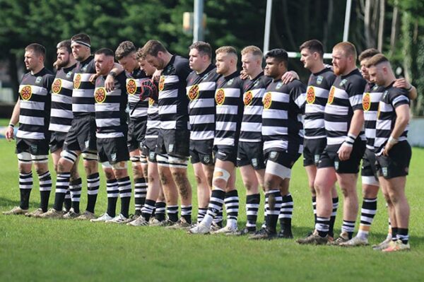 Bedwas players during the minute silence for Peter Thomas before their clash with Maesteg Harlequins