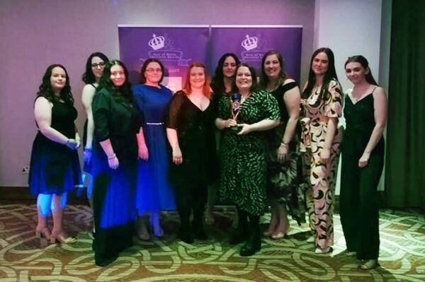 Some of the staff at Clwb Y Ddraig receiving the Best Childcare in Wales award for the third consecutive year