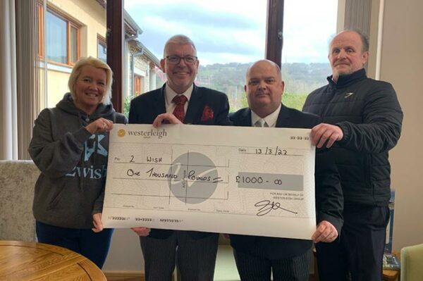 2 Wish charity receiving a £1,000 cheque from Sirhowy Valley Crematorium