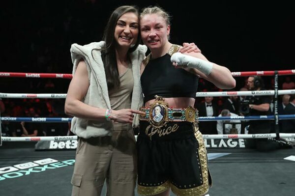 Lauren Price, right, celebrating her Lauren Price is the British Female Welterweight championship win with partner Kariss Artingstall