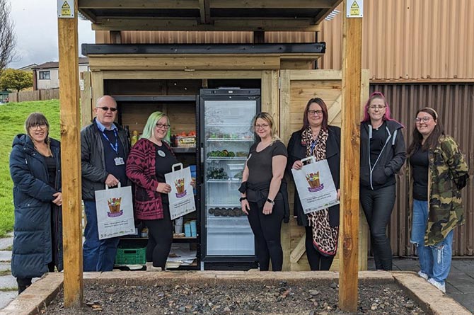 Councillors and volunteers with the new community fridge in Graig y Rhacca