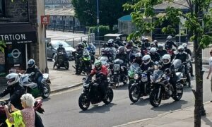 Motorcycles passing through Caerphilly during the charity ride