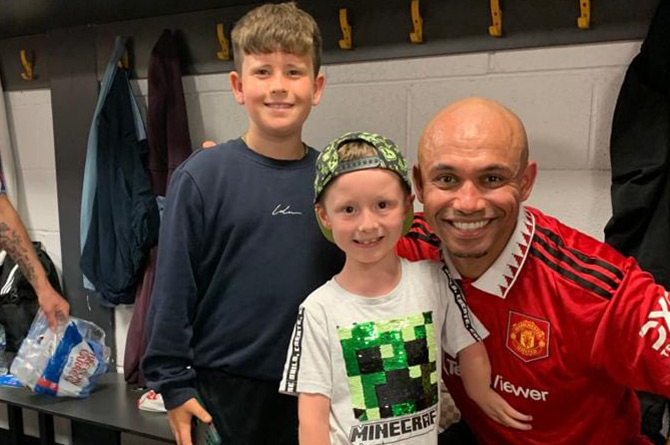 Zac Davies, middle, with former professional footballer Danny Webber