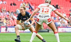 Leeds Rhinos' Bethan Dainton takes on St Helen's' Jodie Cunningham