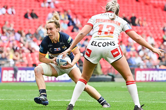 Leeds Rhinos' Bethan Dainton takes on St Helen's' Jodie Cunningham