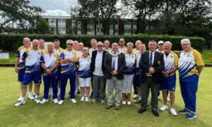 Caerphilly Town Bowls Club members marking their 80th anniversary alongside Caerphilly mayor Mike Prew