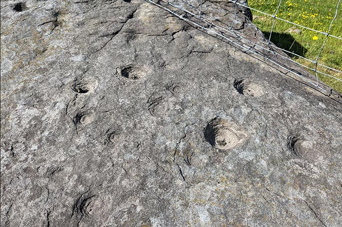 Ancient cup-marks on the stone in Tai’r waun Isaf, Llanfabon