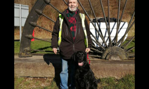 Tony Harris and his Labrador-retriever are often forced into the main road due to parked cars on the pavement