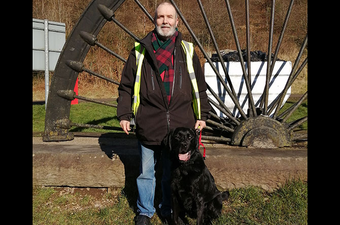 Tony Harris and his Labrador-retriever are often forced into the main road due to parked cars on the pavement