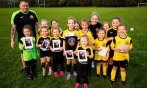 Wales manager Gemma Grainger, back row third from right, visiting Caerphilly Castle minis and juniors