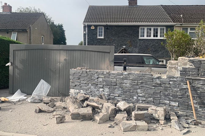 Mark Roberts from Gelligaer has had to lower his front garden wall for the second time