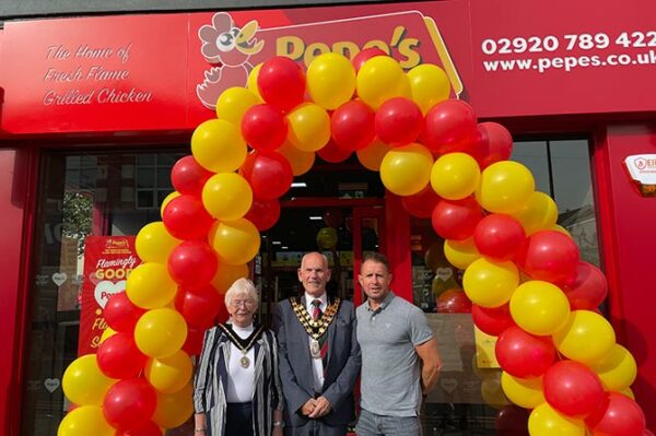 Rugby legend Shane Williams, right, with Caerphilly County Borough Council mayor Mike Adams and Mayor Consort Gloria Adams outside Pepe's