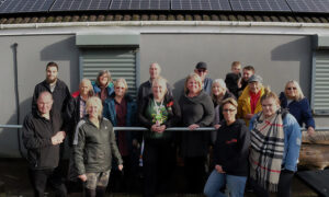 Members of the allotment were joined by representatives of businesses that donated