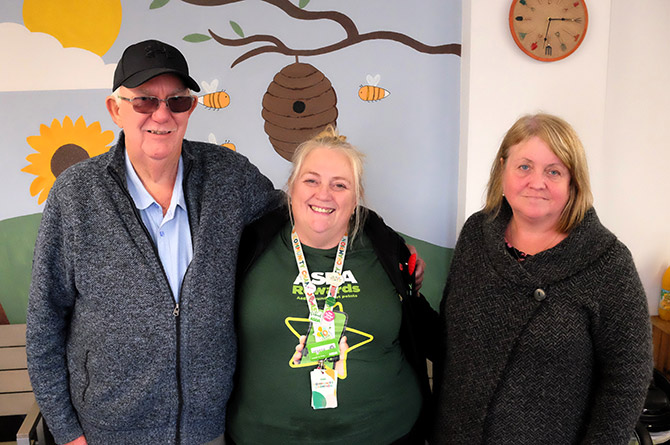 Former chair Ray Hall alongside Asda's Teressa Howell and current chair Tracey Davies