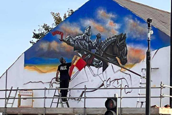 Paul working on the mural next to Caerphilly Castle