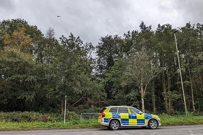 A police car and helicopter was spotted over the woodland area next to Lansbury Park earlier this afternoon