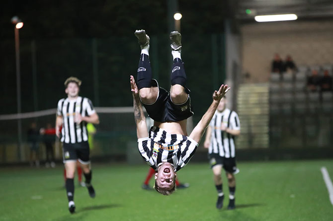 Risca United's Arthur Furness celebrates his goal in style