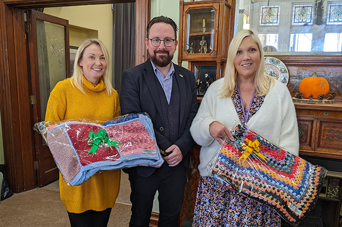 Caerphilly MS Hefin David with Llamau's Julie Inwood and Jaime Grant