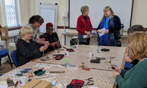 Julie James visiting a crafts class at Caerphilly Miners' Centre