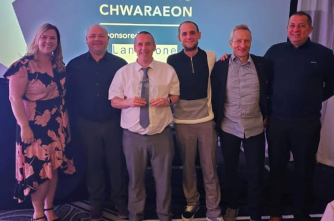 Steve Evans, centre, has been crowned Community Coach of the year 