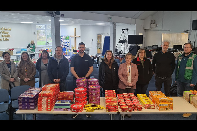 Cllr Carol Andrews visits Caerphilly foodbank with some of the businesses who donated and Caerphilly Cares staff