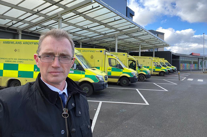Welsh secretary David TC Davies taking a selfie with queuing ambulances at the Grange University Hospital