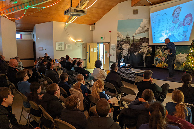 Author Mike Church reading the story at Van Community Centre