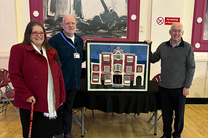 Sandra Olsen, presenting her tapestry to the hall’s chair Derek Alford, and Caerphilly MP Wayne David