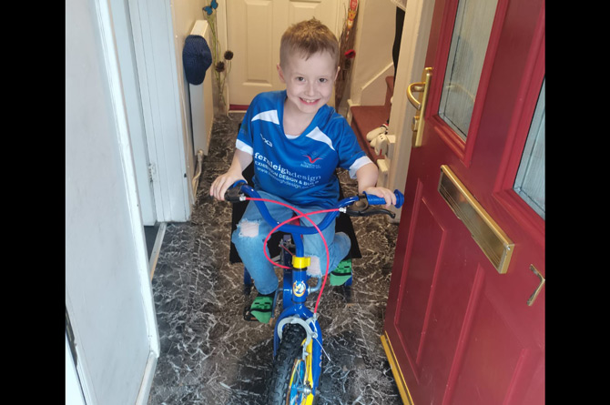 A happy Zac Davies on his brand new custom made bike 