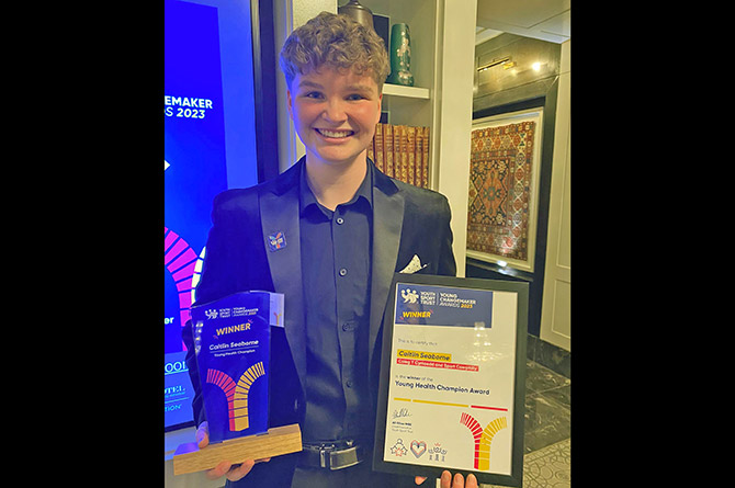 Caitlin Seaborne with her Young Health Champion award