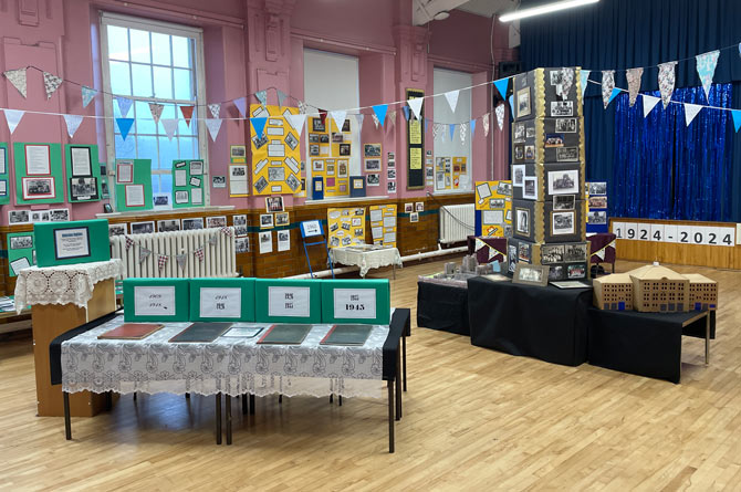 The archive room features snippets and facts about the school across 100 years