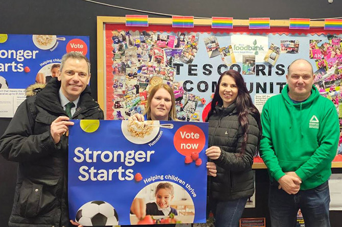 Islwyn MP Chris Evans with representatives from Tesco, Ty Isaf Infants, and Groundwork Wales
